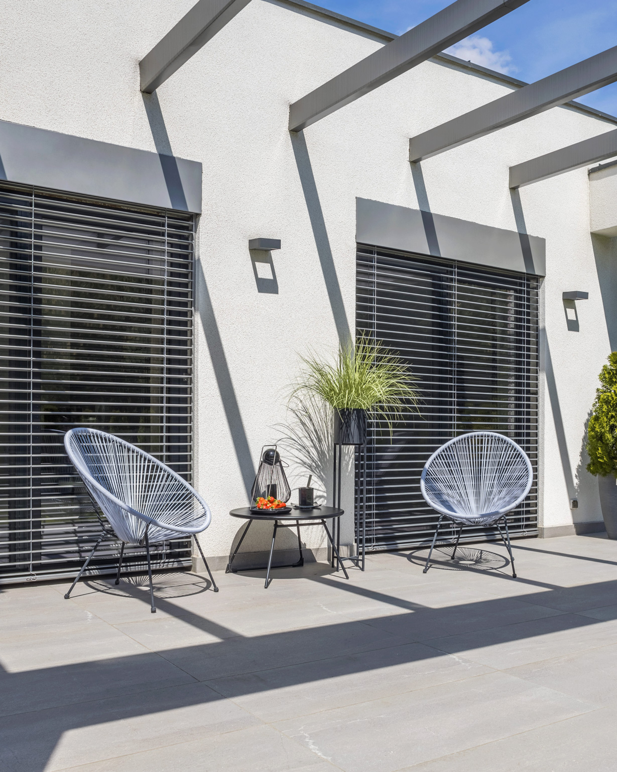 Outside view of elegant suburban house with big window green lawn